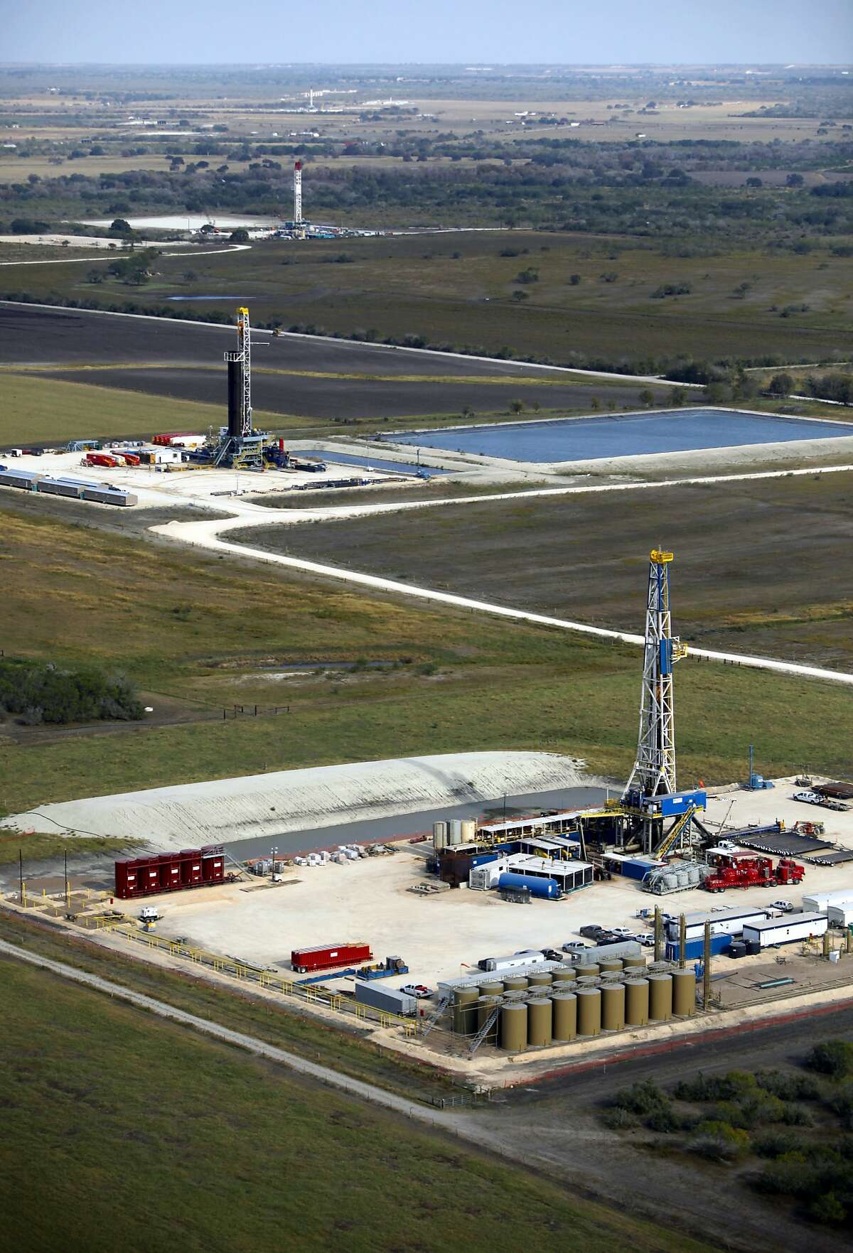 Drilling rigs in the Eagle Ford shale oil play are seen in this Friday Nov. 23, 2012 aerial photo.