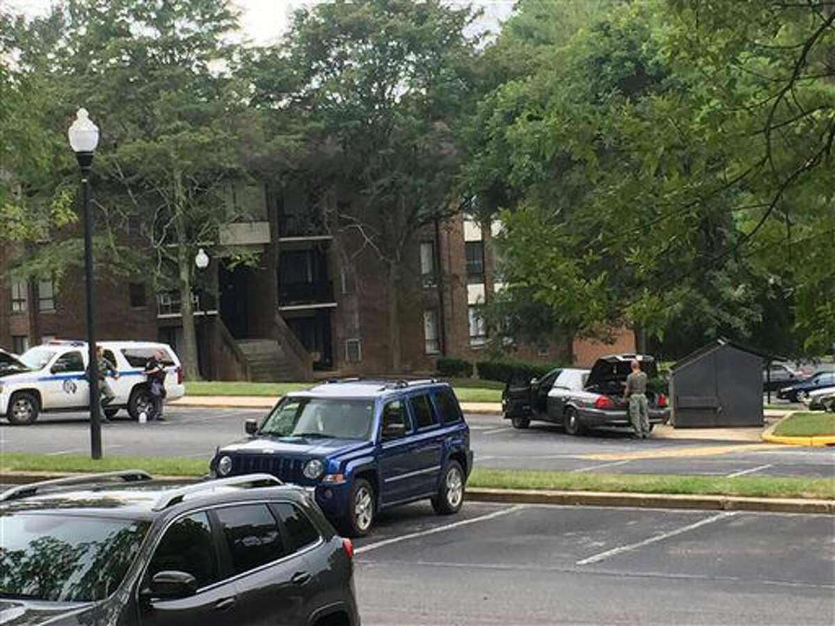 Authorities respond to the scene Randallstown, Md., Monday, Aug. 1, 2016. Baltimore County police say officers have shot and killed a woman who barricaded herself and a child inside a suburban Baltimore apartment and pointed a gun at them. (Maya Earls/The Baltimore Sun via AP)