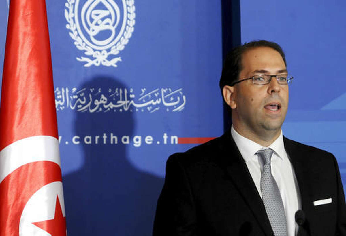 Tunisia's new Prime Minister Youssef Chahed delivers a speech in Tunis, Wednesday, Aug.3, 2016. Chahed served as minister for local affairs in the government that fell over the weekend in a no-confidence vote. The choice of Chahed is controversial in some minds because he is related by marriage to President Beji Caid Essebsi, who nominates the new prime minister. (AP Photo/Hassene Dridi)
