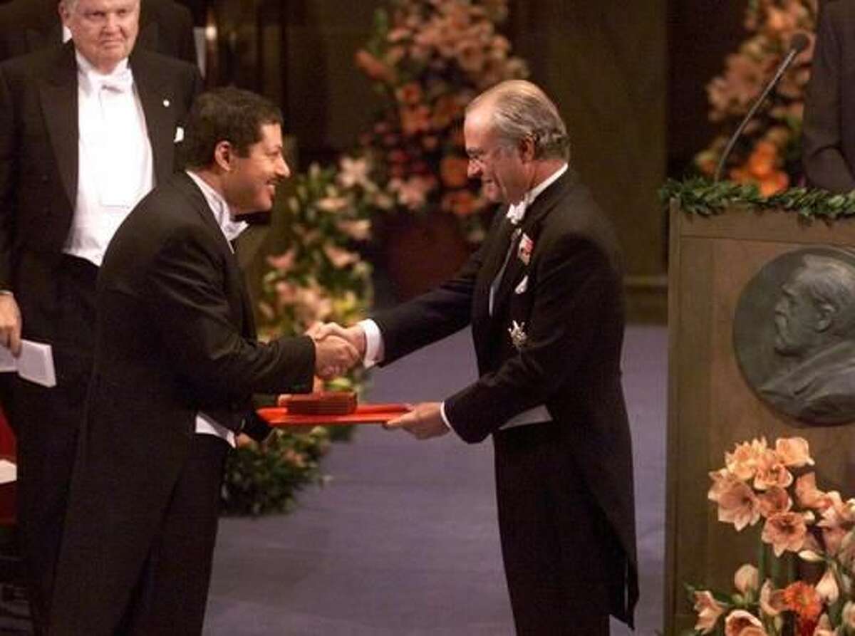 FILE -- In this Dec. 10, 1999 file photo, Professor Ahmed H. Zewail, left, receives the Nobel Prize in chemistry from Swedish King Carl XVI Gustaf, right, at the Concert Hall in Stockholm, Sweden. Egyptian-born Ahmed Zewail, a science adviser to President Obama who won the 1999 Nobel Prize for his work on the study of chemical reactions over immensely short time scales, died Tuesday, Aug. 2, 2016. He was 70. Zewail's death was announced by the California Institute of Technology in Pasadena, Calif., where he was Linus Pauling professor of chemistry and director of the Physical Biology Center for Ultrafast Science and Technology. (AP Photo/Tobias Rostlund, Pool, File)