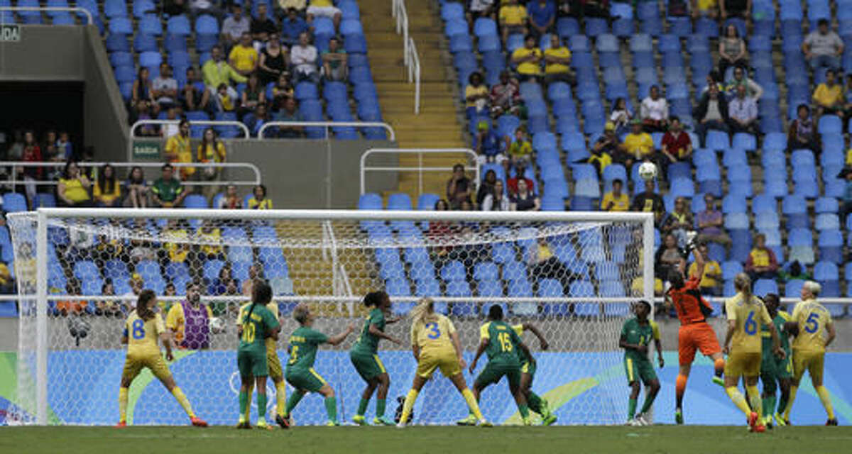 South Africa goalkeeper Roxanne Barker fails to grab the ball before Sweden's Nilla Fischer scored her team's first goal during the opening match of the Women's Olympic Football Tournament between Sweden and South Africa at the Rio Olympic Stadium in Rio de Janeiro, Brazil, Wednesday, Aug. 3, 2016. (AP Photo/Leo Correa)