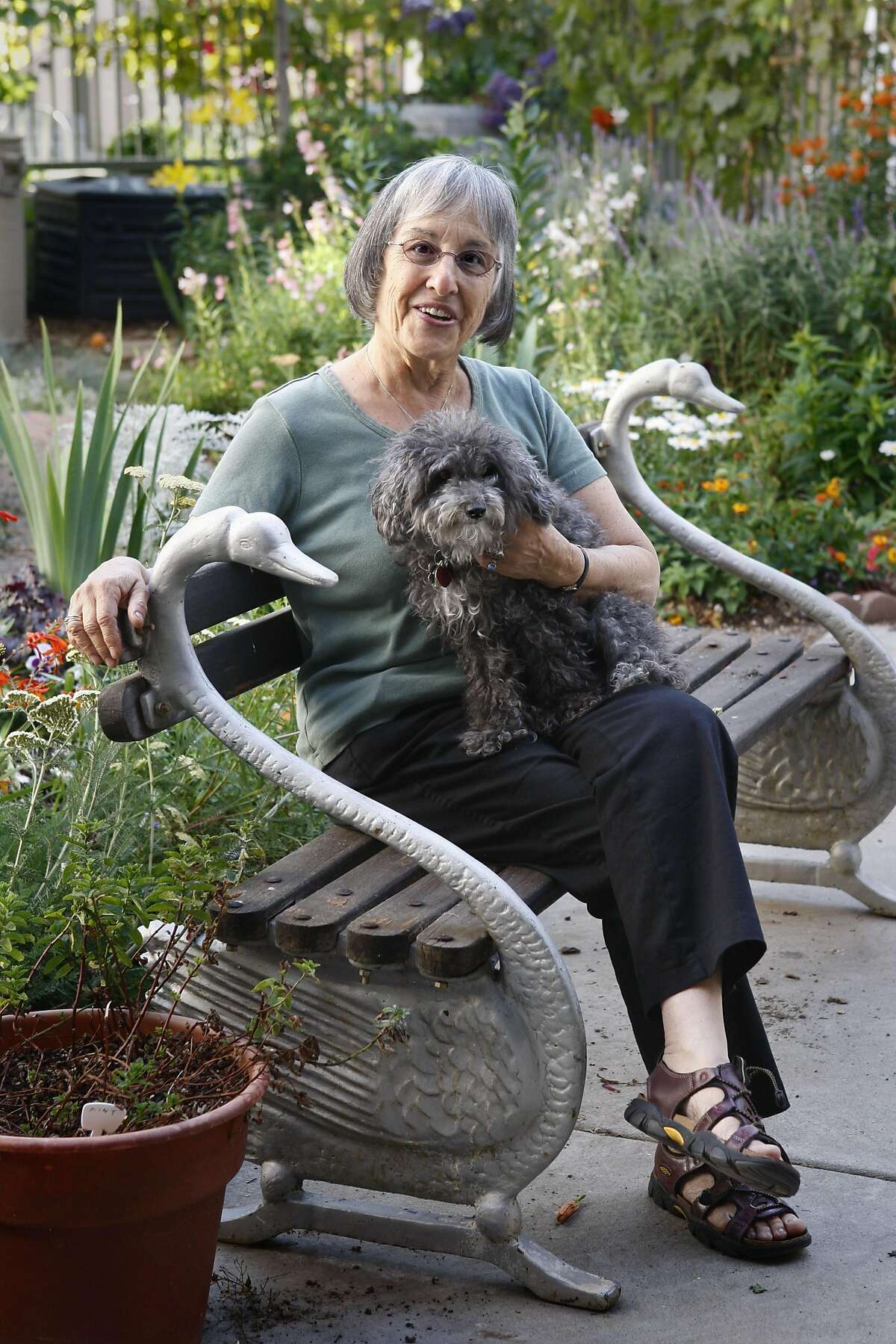Joani Blank, who was the founder of Good Vibrations, is retired in Oakland, Calif., on Thursday, July 2, 2009. She is with her poodle, Bapu-Ji.