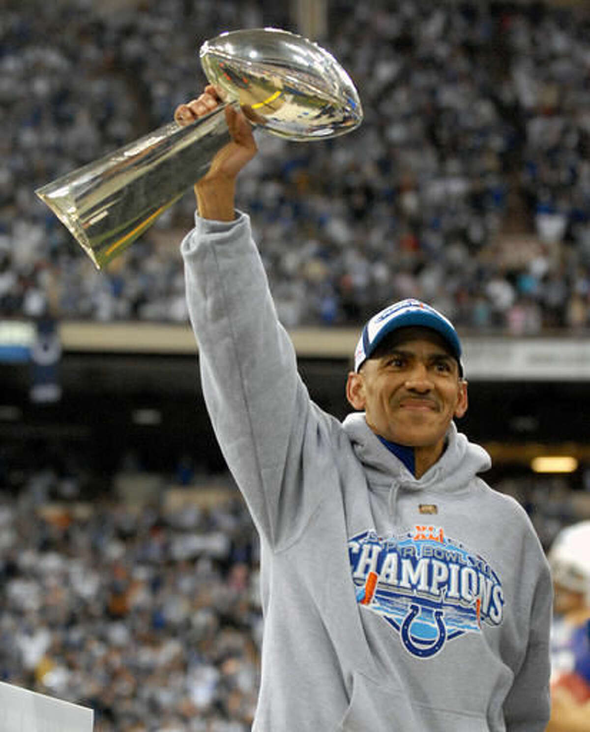 FILE - In this Feb. 5, 2007, file photo, Indianapolis Colts coach Tony Dungy acknowledging fans at a Super Bowl Rally at the RCA Dome in Indianapolis. The Colts beat the Chicago Bears, 29-17, in Super Bowl XLI. The soft-spoken Dungy, who will be inducted into the Pro Football Hall of Fame on Saturday, Aug. 6, 2016. (AP Photo/Tom Strickland, File)
