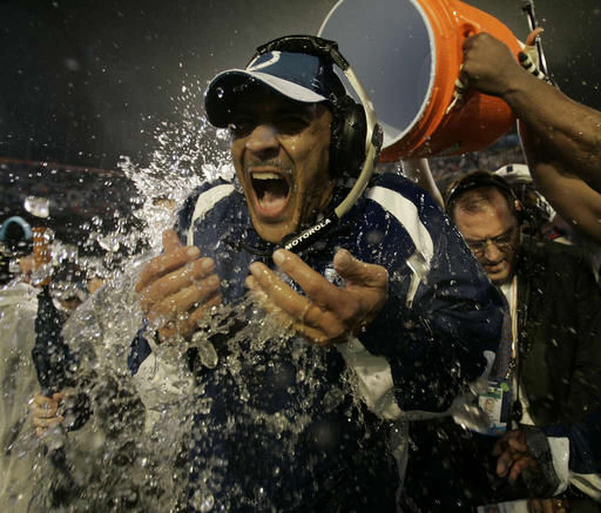 FILE - In this Feb. 4, 2007, file photo, Indianapolis Colts coach Tony Dungy is dunked after the Colts defeated the Chicago Bears, 29-17, in the Super Bowl XLI football game at Dolphin Stadium in Miami. The soft-spoken Dungy, who will be inducted into the Pro Football Hall of Fame on Saturday, Aug. 6, 2016. (AP Photo/David J. Phillip, File)
