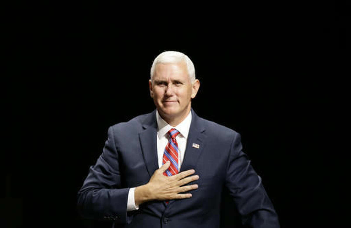 Republican Vice presidential candidate, Indiana Gov. Mike Pence reacts to the audience following a town hall meeting in Raleigh, N.C., Thursday, Aug. 4, 2016. (AP Photo/Gerry Broome)