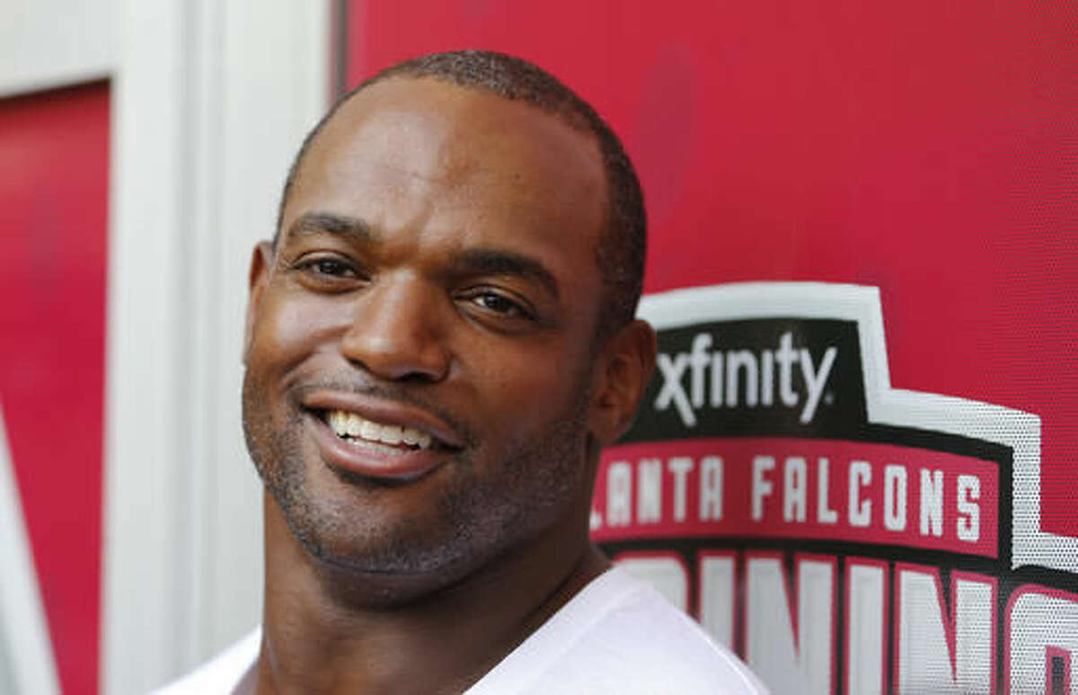 Newly acquired Atlanta Falcons defensive lineman Dwight Freeney talks to reporters as he reports for NFL football training camp Thursday, Aug. 4, 2016, in Flowery Branch, Ga. (AP Photo/John Bazemore)