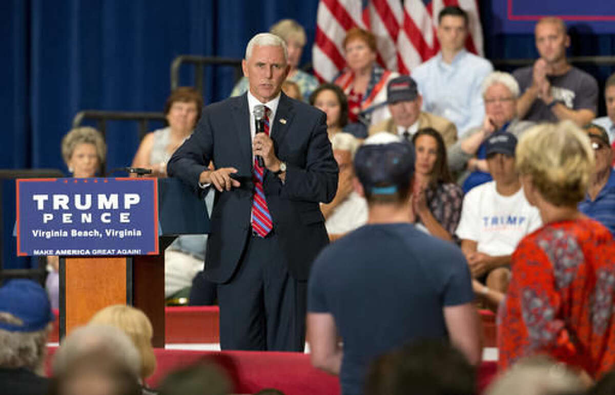Republican vice presidential candidate Indiana Gov. Mike Pence gestures as he answers a question during a town hall meeting in Virginia Beach, Va., Thursday, Aug. 4, 2016. (AP Photo/Steve Helber)