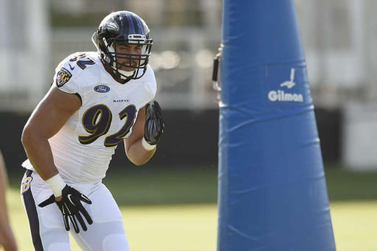 Baltimore Ravens defensive tackle Bronson Kaufusi runs a drill during NFL football training camp in Owings Mills, Md., Thursday, Aug. 4, 2016. Ravens rookie defensive end Bronson Kaufusi will miss the 2016 season after breaking his left ankle during practice Thursday. The injury occurred when another player fell on Kaufusi's leg during a non-live drill(AP Photo/Gail Burton)