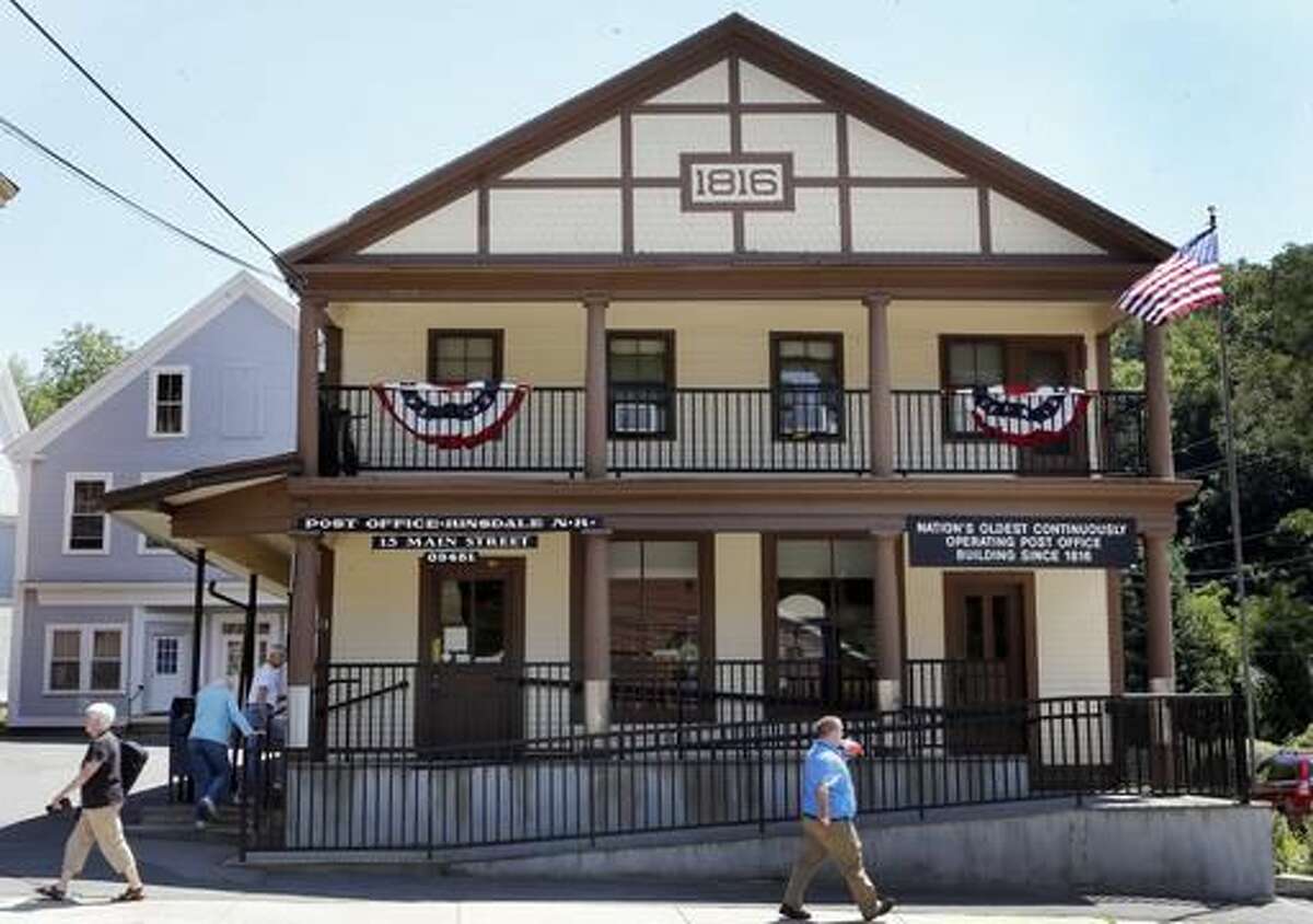 the oldest continuously operating post office in the U.S., the Hinsdale Post Office is seen Thursday Aug. 4, 2016 in Hinsdale, New Hampshire. The post office is celebrating it's 200th birthday. (AP Photo/Jim Cole)