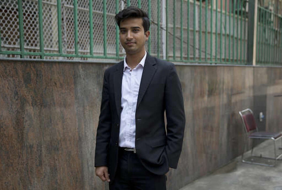 Shitij, 26, in sales and marketing in the hotel industry, poses for a photo in New Delhi, India, on Monday, Aug. 1, 2016. "America is a land of opportunities. I think that anybody with good ideas, if they want to make a mark, it gives you an equal opportunity in that country. America stands out because people recognize merit out there," he says. (AP Photo/Tsering Topgyal)