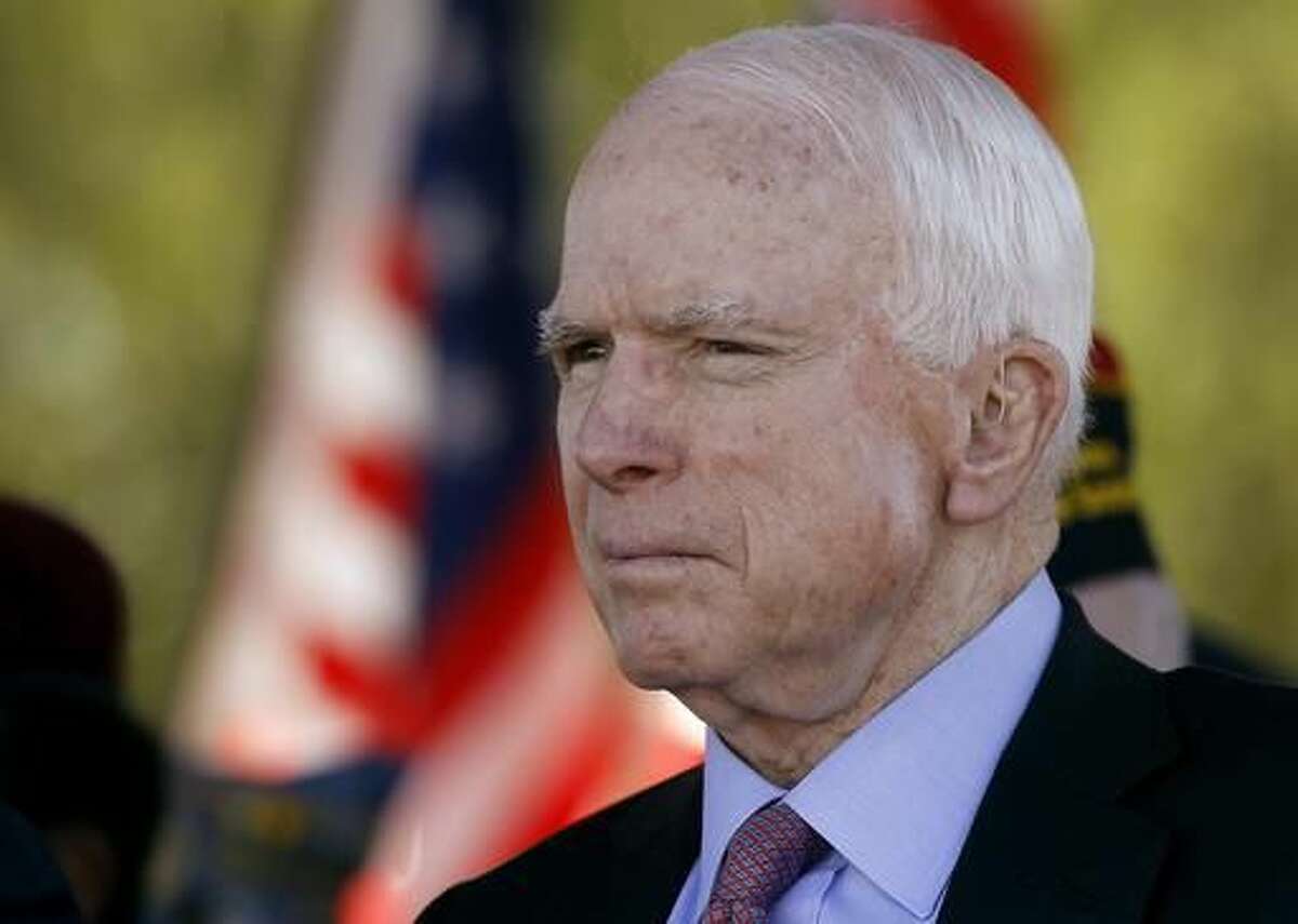 FILE - In this Monday, May 30, 2016, Sen. John McCain, R-Ariz, looks on during a Phoenix Memorial Day Ceremony at the National Memorial Cemetery of Arizona in Phoenix. Eight years after stumping across the nation as the Republican Party's presidential candidate, McCain is back on the campaign trail in his home state as he faces a primary challenge and a strong Democratic opponent in the general election. (AP Photo/Ralph Freso, File)