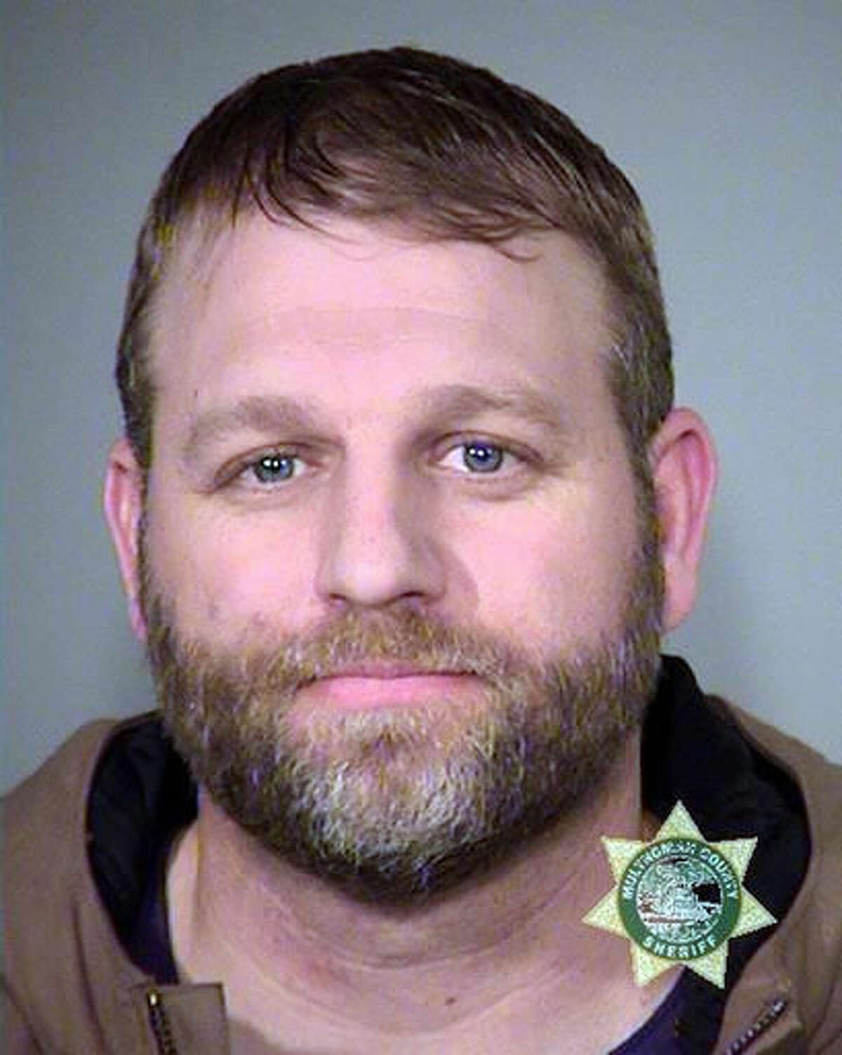 FILE--This Jan. 27, 2016, photo provided by the Multnomah County Sheriff's Office shows Ammon Bundy, one of the members of an armed group that occupied central Oregon's Malheur National Wildlife Refuge as part of a dispute over public lands in the Western U.S. U.S. District Judge Robert E. Jones said in the declaration Friday, Aug. 5, 2016, that he allowed six defendants accused in the armed occupation of an Oregon wildlife refuge earlier this year to meet with their attorneys, and sometimes with each other, at a special courthouse location after they complained about access to their attorneys. (Multnomah County Sheriff via AP, file)