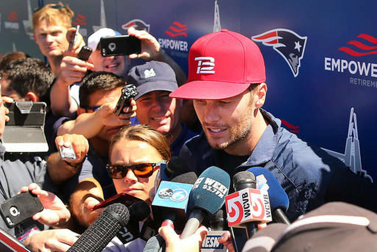New England Patriots quarterback Tom Brady speaks to media at football training camp, Friday, Aug. 5, 2016, in Foxborough, Mass. Brady said his decision not to pursue his appeal of a four-game suspension in the "Deflategate" saga was "a personal decision." The four-time Super Bowl winner spoke for the first time Friday at New England's training camp. He is allowed to practice with the team and play in the Patriots' preseason games, but will miss the first four regular-season games. (John Tlumacki/Boston Globe via AP)