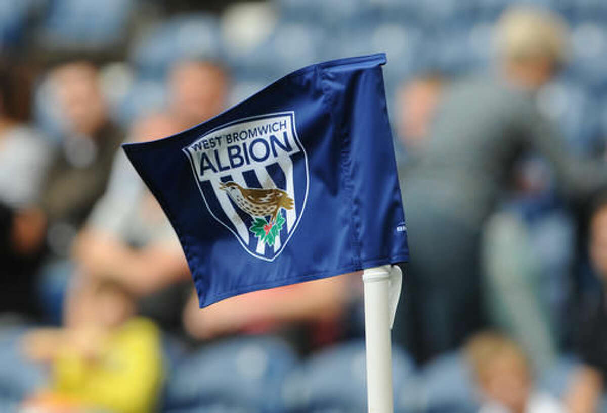 FILE - In this Sunday, Aug. 23, 2015, file photo, a West Bromwich corner flag flies during the English Premier League soccer match between West Bromwich Albion and Chelsea at the Hawthorns, West Bromwich, England. West Bromwich Albion says a Chinese investment group has agreed to buy the English Premier League club. West Brom said in a statement on Friday that Yunyi Guokai Sports Development Limited, headed by entrepreneur Lai Guochuan, will complete a takeover of the club subject to approval by the Premier League and English financial authorities. (AP Photo/Rui Vieira, FIle)