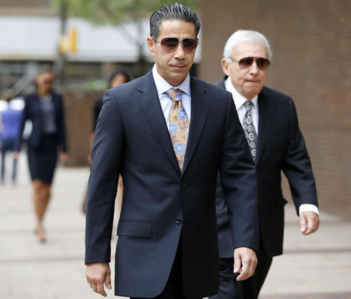 FILE - In this Oct. 10, 2014 file photo, Joey Merlino arrives at the federal court in Philadelphia. The flamboyant alleged head of the Philadelphia mob who has repeatedly beat murder charges in past cases is among nearly four dozen people Thursday, Aug. 4, 2016, with being part of an East Coast crime syndicate. (Yong Kim/Philadelphia Daily News via AP, File)