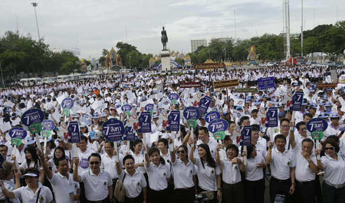 FILE - In this Thursday, Aug. 4, 2016, file photo, government workers attend a rally to encourage people to vote in the upcoming referendum polling day in Bangkok, Thailand. On Sunday, Thailand is holding a referendum on a new constitution drafted by the military government with none of the trappings of democracy: no rallies, no campaigns and virtually no debate. After all, the new constitution, if approved, would allow the junta to keep it in control for several years and enshrine a watered-down democracy. (AP Photo/Sakchai Lalit, File)