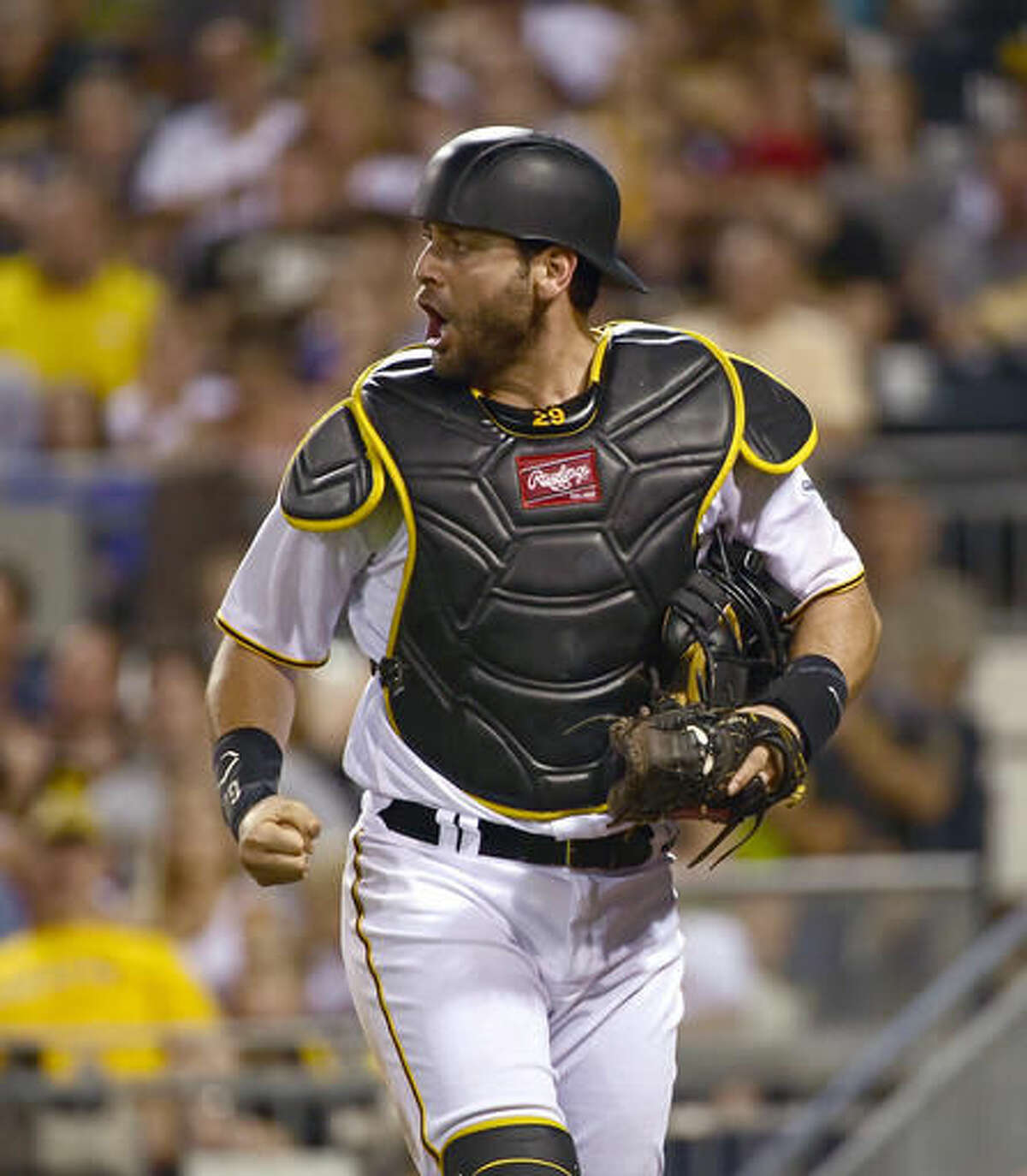 Pittsburgh Pirates catcher Francisco Cervelli clenches his fist after a strikeout in the eighth inning of a baseball game against the Cincinnati Reds in Pittsburgh, Friday, Aug. 5, 2016. (AP Photo/Fred Vuich)