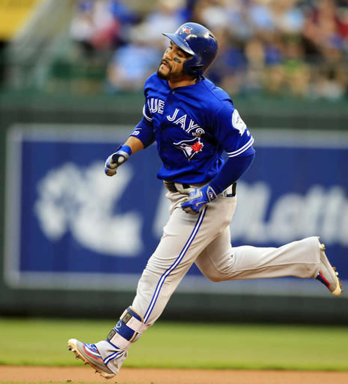 Toronto Blue Jays' Devon Travis rounds the bases after hitting a solo home run off Kansas City Royals relief pitcher Dillon Gee during the first inning of a baseball game at Kauffman Stadium in Kansas City, Mo., Friday, Aug. 5, 2016. (AP Photo/Orlin Wagner)