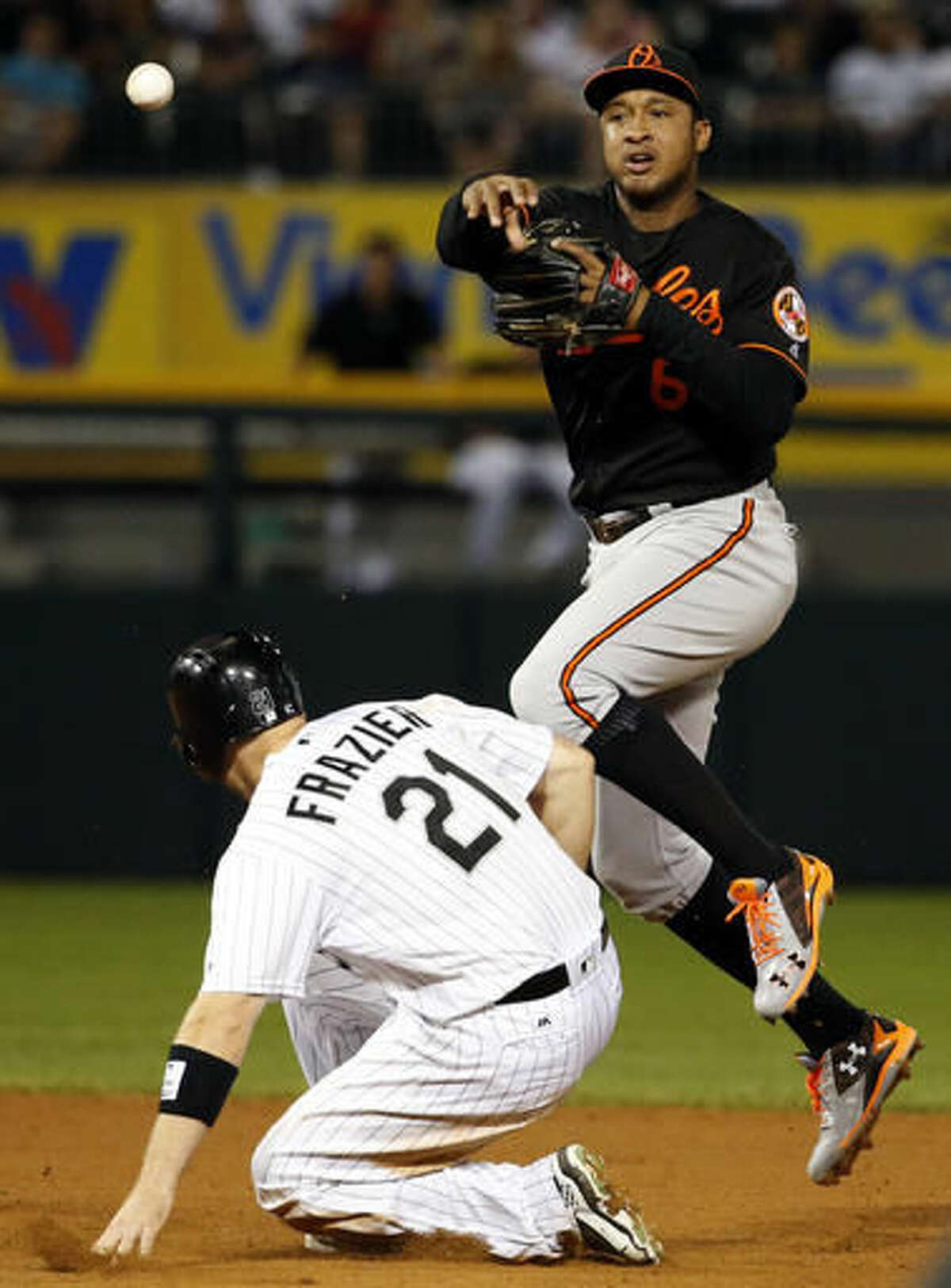 Baltimore Orioles second baseman Jonathan Schoop, right, throws to first after forcing out Chicago White Sox's Todd Frazier during the eighth inning of a baseball game Friday, Aug. 5, 2016, in Chicago. Avisail Garcia was safe at first base. (AP Photo/Nam Y. Huh)