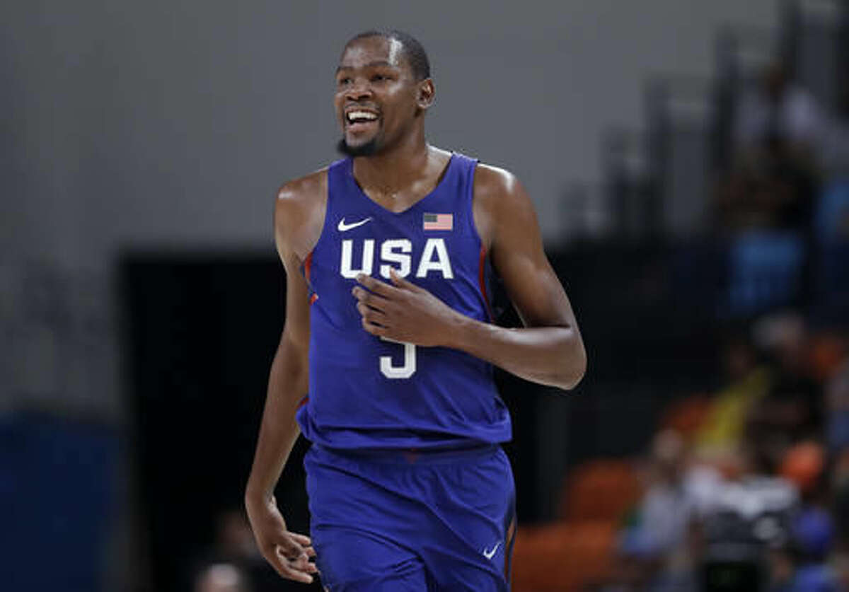 United States' Kevin Durant smiles after making a three-point basket during a basketball game against China at the 2016 Summer Olympics in Rio de Janeiro, Brazil, Saturday, Aug. 6, 2016. (AP Photo/Charlie Neibergall)