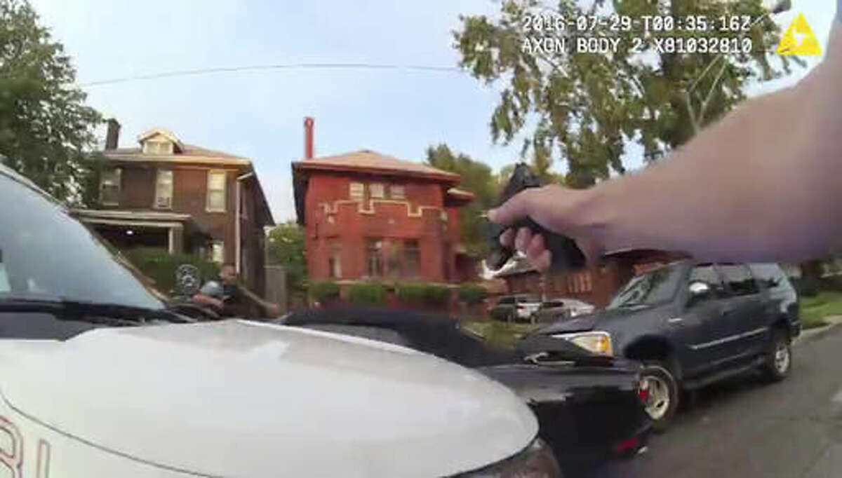In this frame grab from a body cam provided by the Independent Police Review Authority, Chicago police officers fire into a stolen car driven by Paul O'Neal on July 28, 2016, in Chicago. O'Neal's autopsy results showed he died of a gunshot wound to the back. The video released Friday, Aug. 5, 2016, was the city's first release of video of the fatal police shooting under a new Chicago policy that calls for such images to be made public within 60 days. (Chicago Police Department/Independent Police Review Authority via AP)