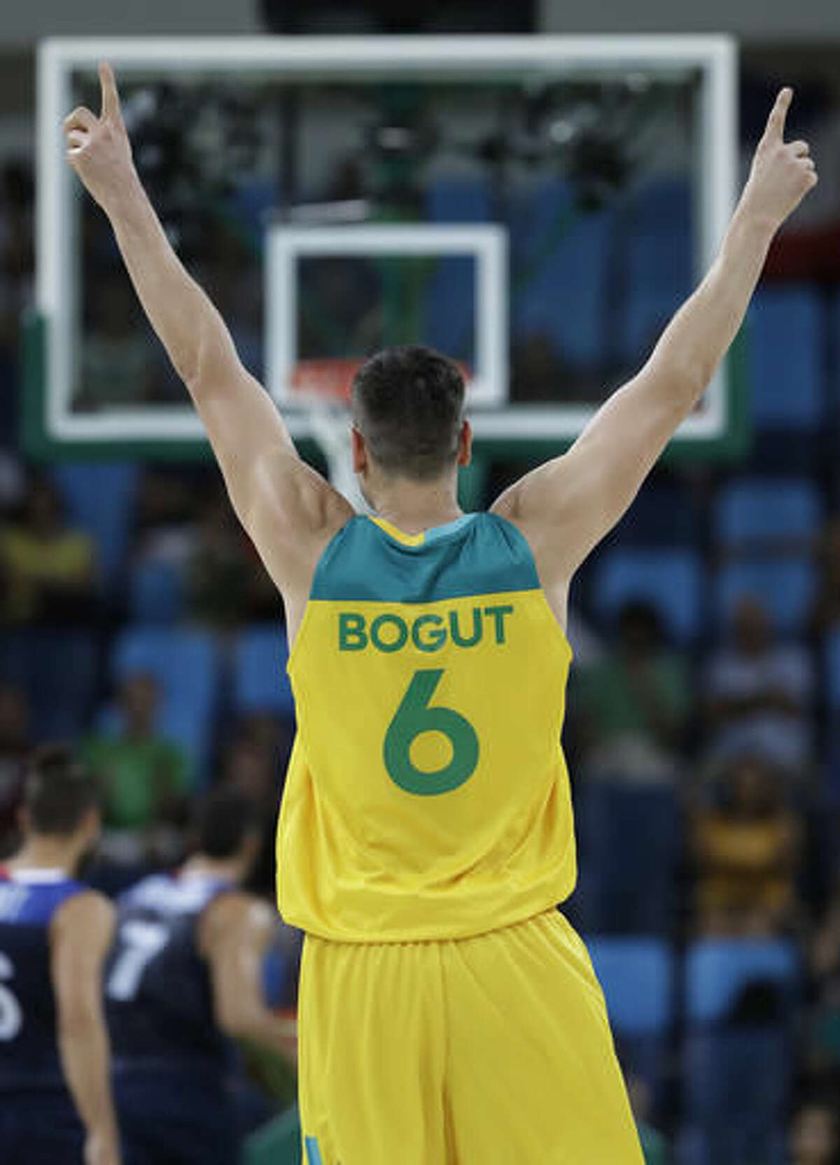 Australia's Andrew Bogut (6) celebrates a teammates score during a men's basketball game against France at the 2016 Summer Olympics in Rio de Janeiro, Brazil, Saturday, Aug. 6, 2016. (AP Photo/Eric Gay)