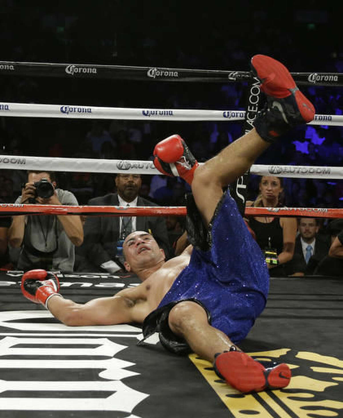Alexander Brand goes tumbling to the mat during the ninth round of his light heavyweight boxing match against Andre Ward on Saturday, Aug. 6, 2016, in Oakland, Calif. Ward won the fight in a unanimous decision. (AP Photo/Eric Risberg)