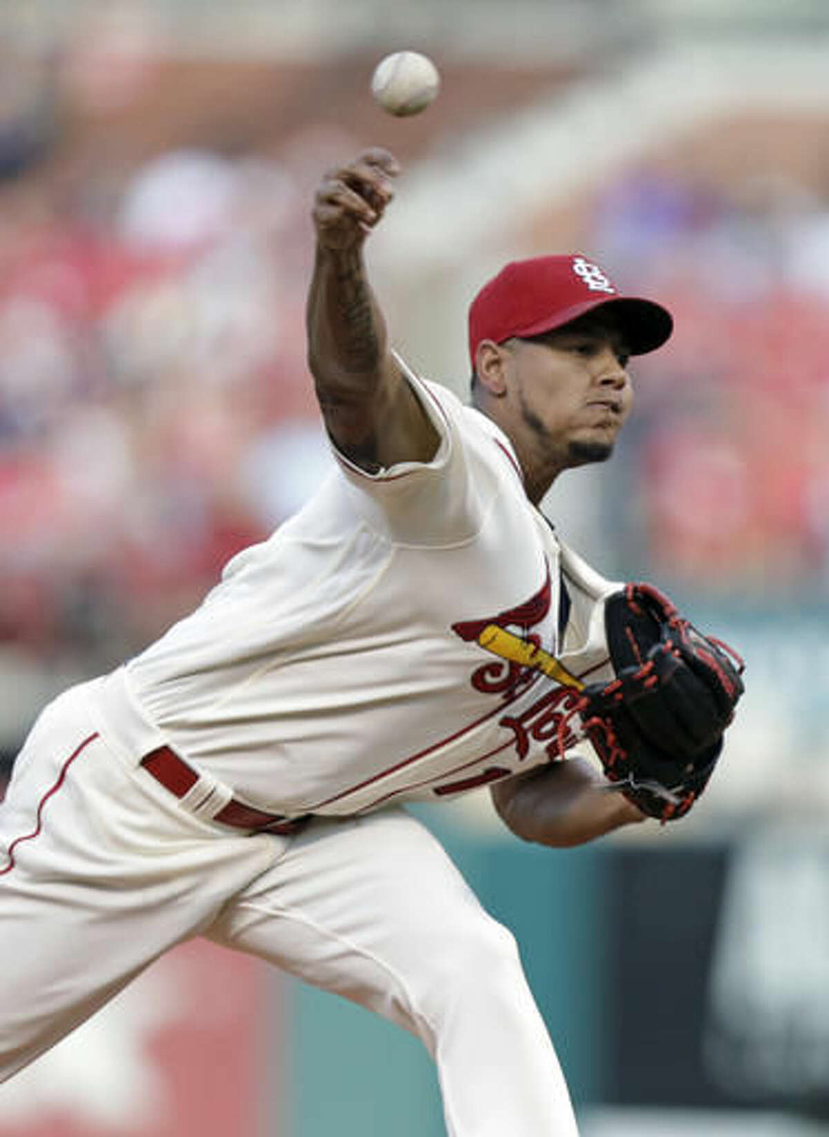 St. Louis Cardinals starting pitcher Carlos Martinez delivers a pitch in the first inning of a baseball game against the Atlanta Braves, Saturday, Aug. 6, 2016, in St. Louis. (AP Photo/Tom Gannam)