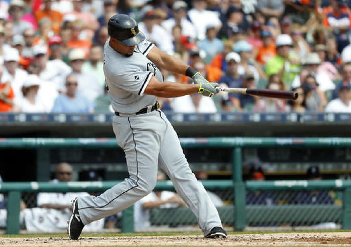 Chicago White Sox's Jose Abreu hits a two-run home run against the Detroit Tigers in the second inning of a baseball game Thursday, Aug. 4, 2016 in Detroit. (AP Photo/Paul Sancya)
