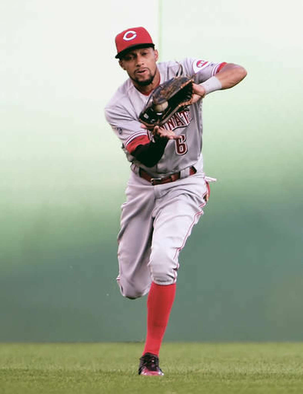 Cincinnati Reds center fielder Billy Hamilton makes a catch in the first inning of a baseball game against the Pittsburgh Pirates in Pittsburgh, Saturday, Aug. 6, 2016. (AP Photo/Fred Vuich)