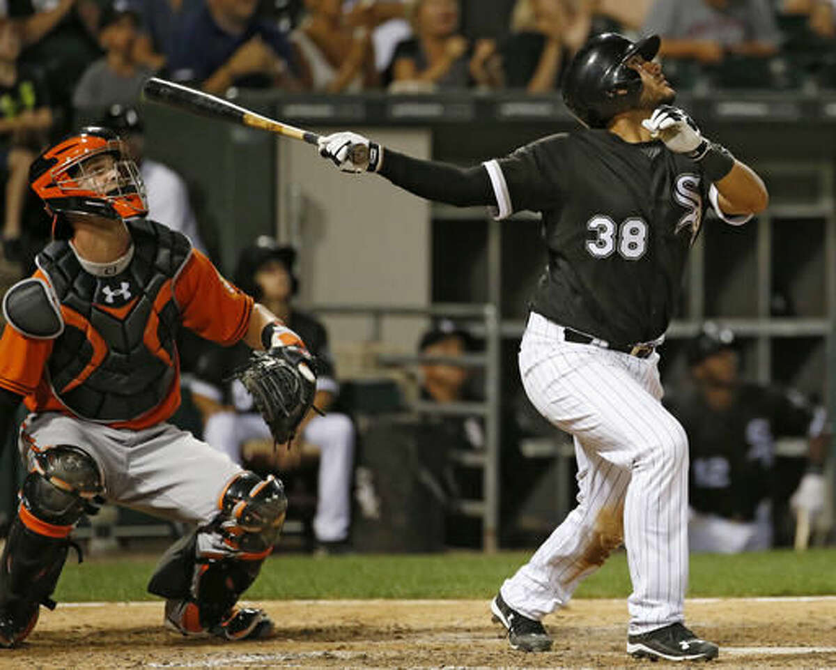 Chicago White Sox's Omar Narvaez, right, watches after hitting a one-run single as Baltimore Orioles catcher Caleb Joseph watches on during the seventh inning of a baseball game in Chicago, Saturday, Aug. 6, 2016. (AP Photo/Nam Y. Huh)