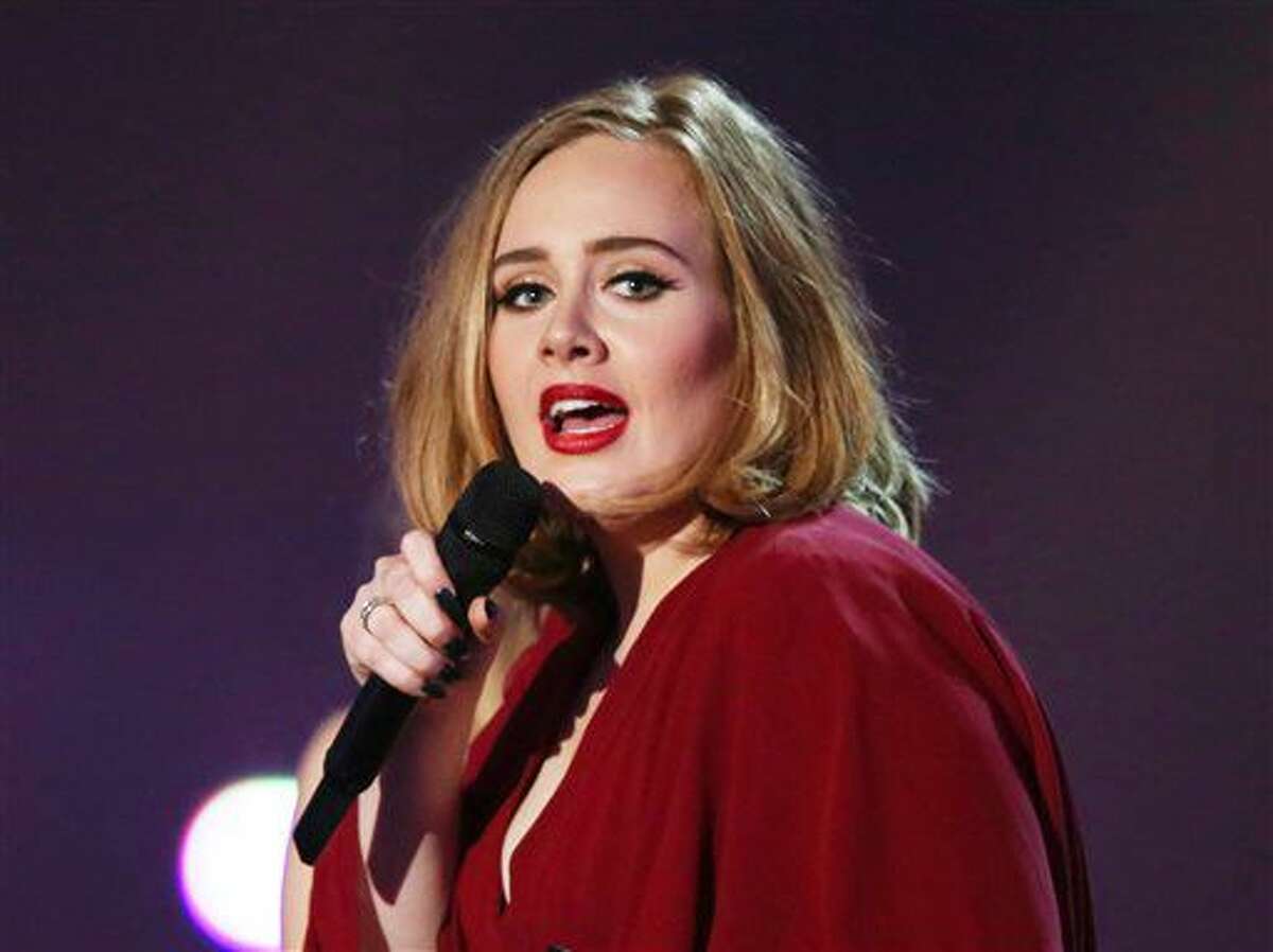 FILE - In this Feb. 24, 2016 file photo shows Adele onstage at the Brit Awards 2016 at the 02 Arena in London. Adele told concertgoers at a show in San Jose, Calif., on Sunday, July 31, that her credit card was declined at a fashion retailer earlier that day. (Photo by Joel Ryan/Invision/AP, File)