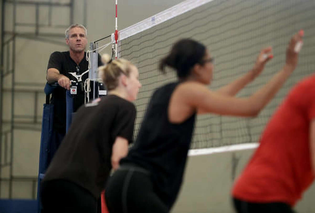 United States women's volleyball head coach Karch Kiraly, left, watches as members of his team practice at the Navy School High Performance Training Center before the start of the 2016 Summer Olympics in Rio de Janeiro, Brazil, Thursday, Aug. 4, 2016. (AP Photo/Jeff Roberson)