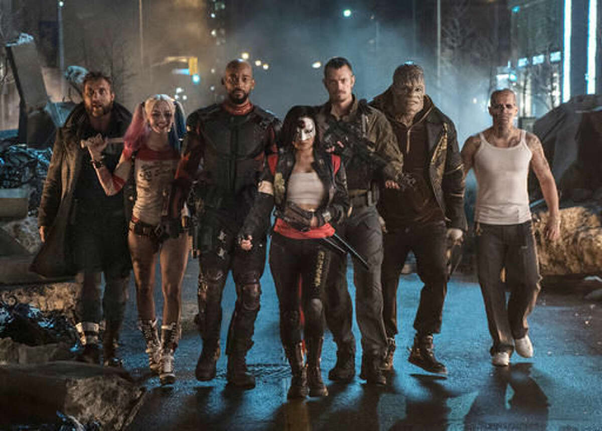 This image released by Warner Bros. Pictures shows, from left, Jai Courtney as Boomerang, Margot Robbie as Harley Quinn, Will Smith as Deadshot, Karen Fukuhara as Katana, Joel Kinnaman as Rick Flag, Adewale Akinnuoye-Agbaje as Killer Croc and Jay Hernandez as Diablo, in a scene from "Suicide Squad." (Clay Enos/Warner Bros. Pictures via AP)