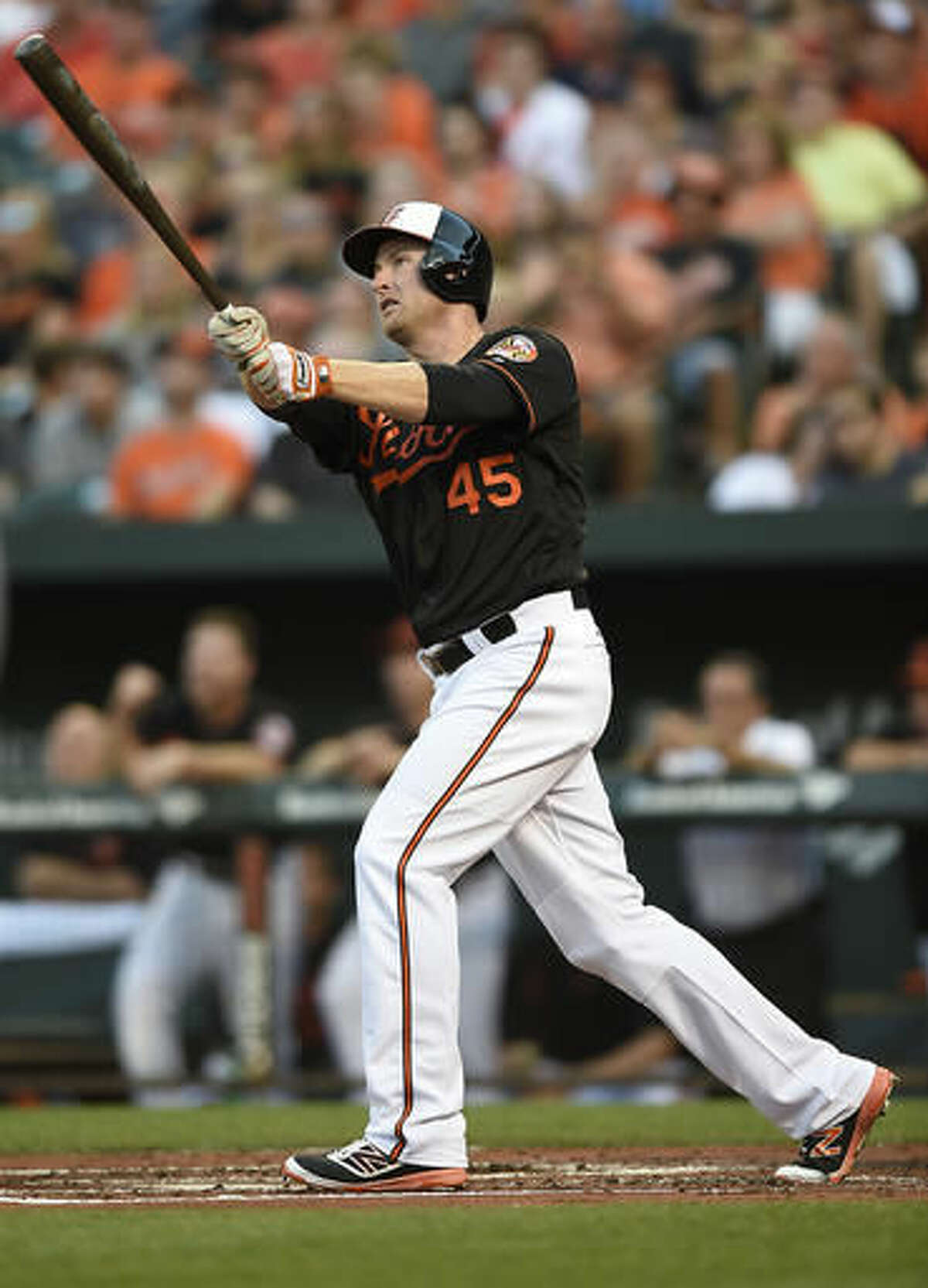 FILE - In this July 22, 2016, file photo, Baltimore Orioles' Mark Trumbo follows through on a three-run home run against the Cleveland Indians in the first inning of a baseball game, in Baltimore. Coming off another series win at Camden Yards, this time over the AL West-leading Texas Rangers, the Orioles boast a major-league best 39-17 record at home. (AP Photo/Gail Burton, File)