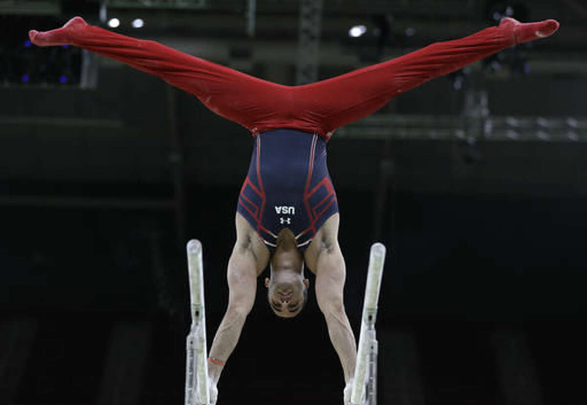 Gymnast Danell Leyva from the United States trains on the parallel bars ahead of the 2016 Summer Olympics in Rio de Janeiro, Brazil, Wednesday, Aug. 3, 2016. (AP Photo/Rebecca Blackwell)