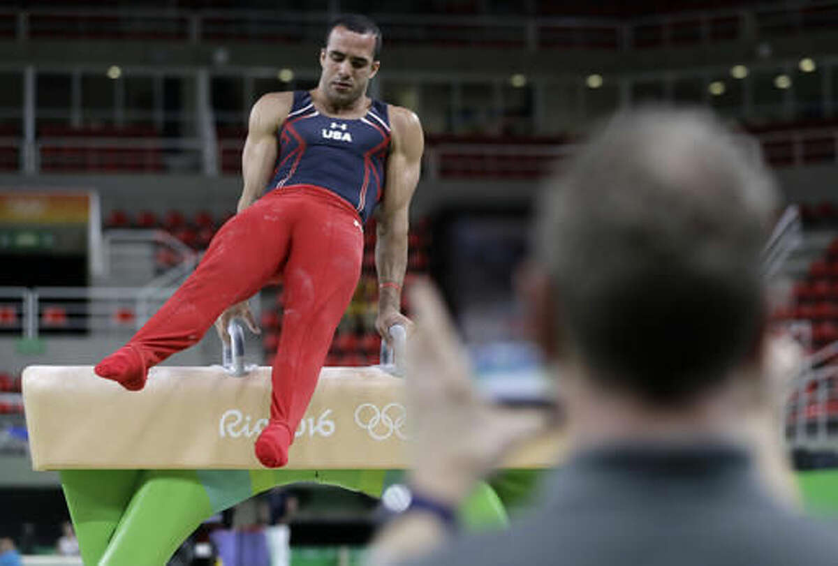 United States' Danell Leyva is filmed as he performs on the pommel horse during a training session ahead of the 2016 Summer Olympics in Rio de Janeiro, Brazil, Wednesday, Aug. 3, 2016. (AP Photo/Dmitri Lovetsky)
