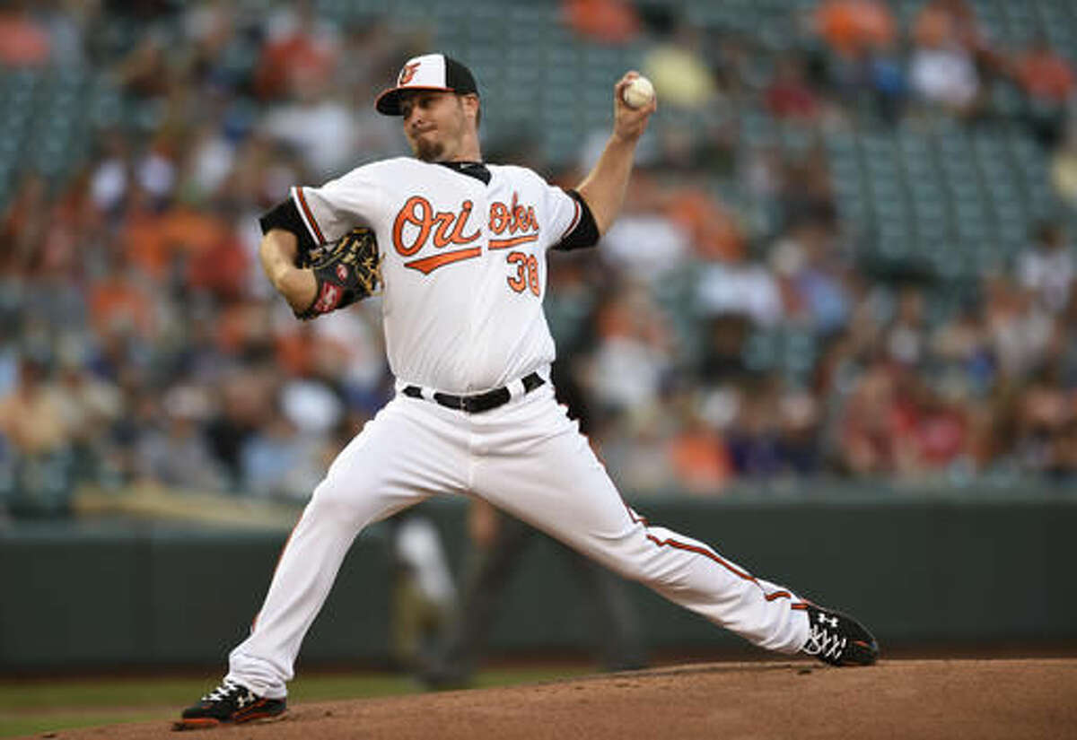 Baltimore Orioles starting pitcher Wade Miley throws to a Texas Rangers batter during the first inning of a baseball game Thursday, Aug. 4, 2016, in Baltimore. (AP Photo/Gail Burton)