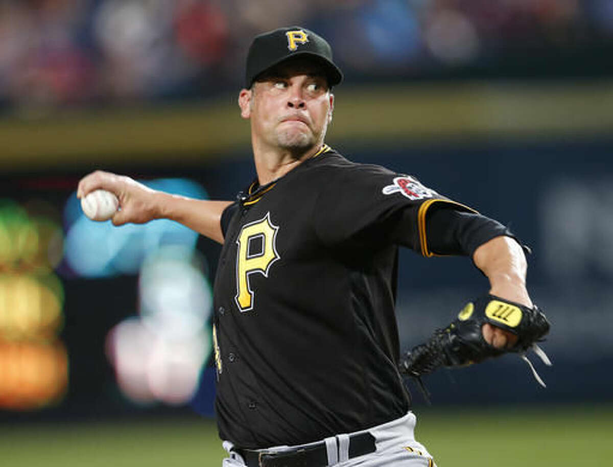 Pittsburgh Pirates starting pitcher Ryan Vogelsong works during the first inning of a baseball game against Atlanta Braves on Thursday, Aug. 4, 2016, in Atlanta. (AP Photo/John Bazemore)