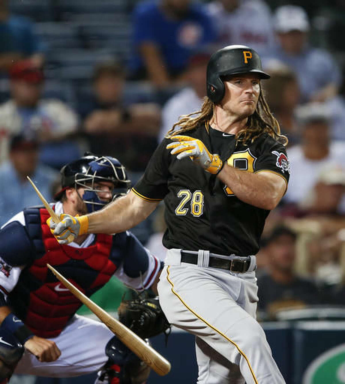 Pittsburgh Pirates pinch-hitter John Jaso (28) breaks his bat as he hits into a double play during the seventh inning of a baseball game against the Atlanta Braves on Thursday, Aug. 4, 2016, in Atlanta. (AP Photo/John Bazemore)