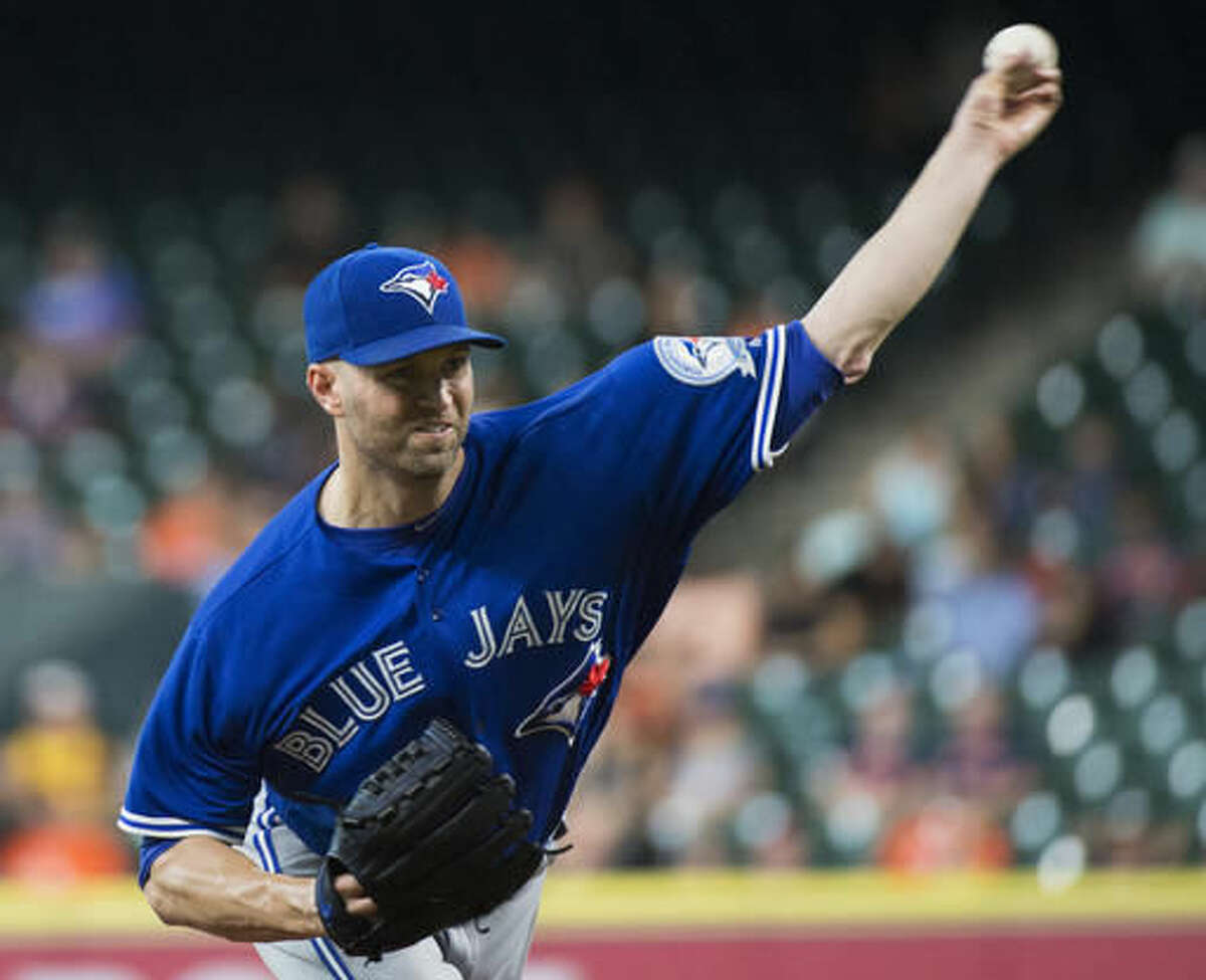 Toronto Blue Jays' J.A. Happ (pitches against the Houston Astros during the first inning of a baseball game Thursday, Aug. 4, 2016, in Houston. (AP Photo/George Bridges)