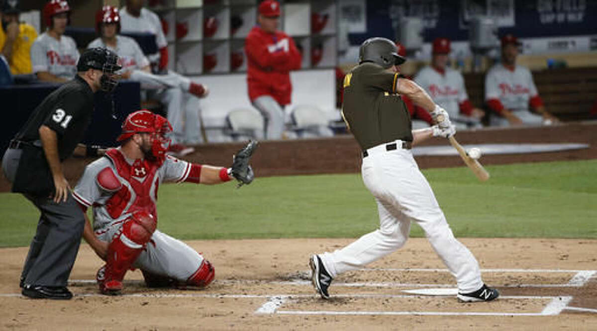 San Diego Padres' Alex Dickerson drills a base hit against the Philadelphia Phillies during the second inning of a baseball game Friday, Aug. 5, 2016, in San Diego. (AP Photo/Lenny Ignelzi)