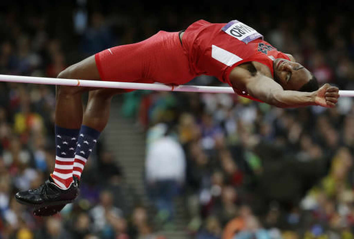 FILE - In this Aug. 7, 2012, file photo, United States' Erik Kynard clears the bar in the men's high jump final at the Summer Olympics in London. How about comparing vertical leaps among NFL players to Olympic high jumping? Well, it’s similar to weightlifting in that athletic ability and technique go hand-in-hand. You won’t see a wide receiver flopping backward over a bar while hauling in a touchdown pass. (AP Photo/David J. Phillip, File)