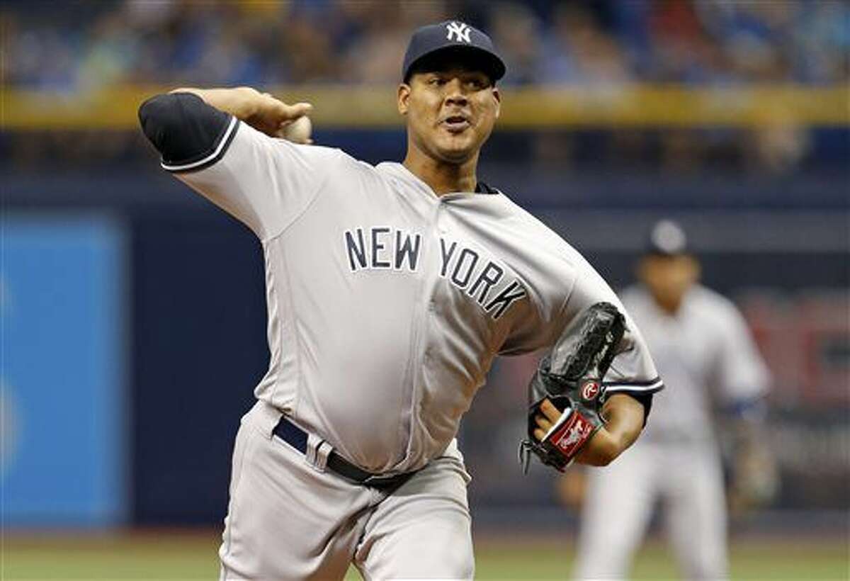FILE - This July 29, 2016 file photo shows New York Yankees starting pitcher Ivan Nova throwing during the first inning of a baseball against the Tampa Bay Rays game in St. Petersburg, Fla. The retooling New York Yankees have dealt right-hander Ivan Nova to the Pittsburgh Pirates for to players to be named. (AP Photo/Mike Carlson)