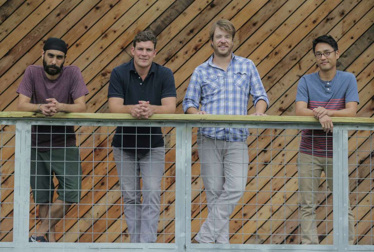 Jagi Katial, Will Garwood, Will Thomas and Johnny So, stand on the balcony of White Oak Music Hall on Tuesday, Aug. 16, 2016, in Houston. ( Elizabeth Conley / Houston Chronicle )