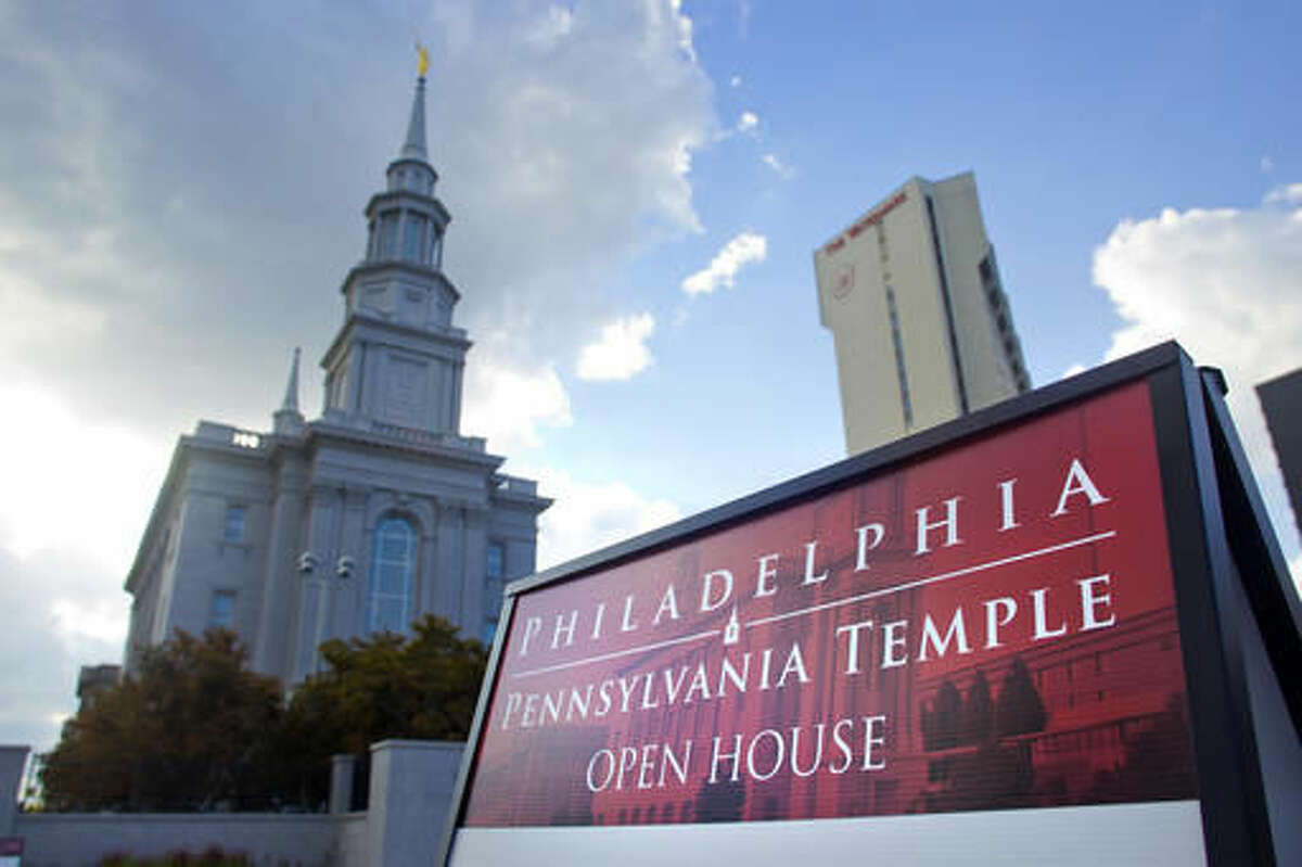 This Aug. 3, 2016 photo shows the new Mormon Temple, center, set to open near Logan Square in Center City in Philadelphia. The Mormon church is offering the general public a rare opportunity to tour its 152nd temple, a first of its kind in Pennsylvania. Regional membership in The Church of Jesus Christ of Latter-day Saints has grown to more than 40,000 members in parts of Pennsylvania, Delaware, New Jersey and Maryland. The growth prompted church leadership in 2008 to announce the temple plans. (AP Photo/Michael Sisak)