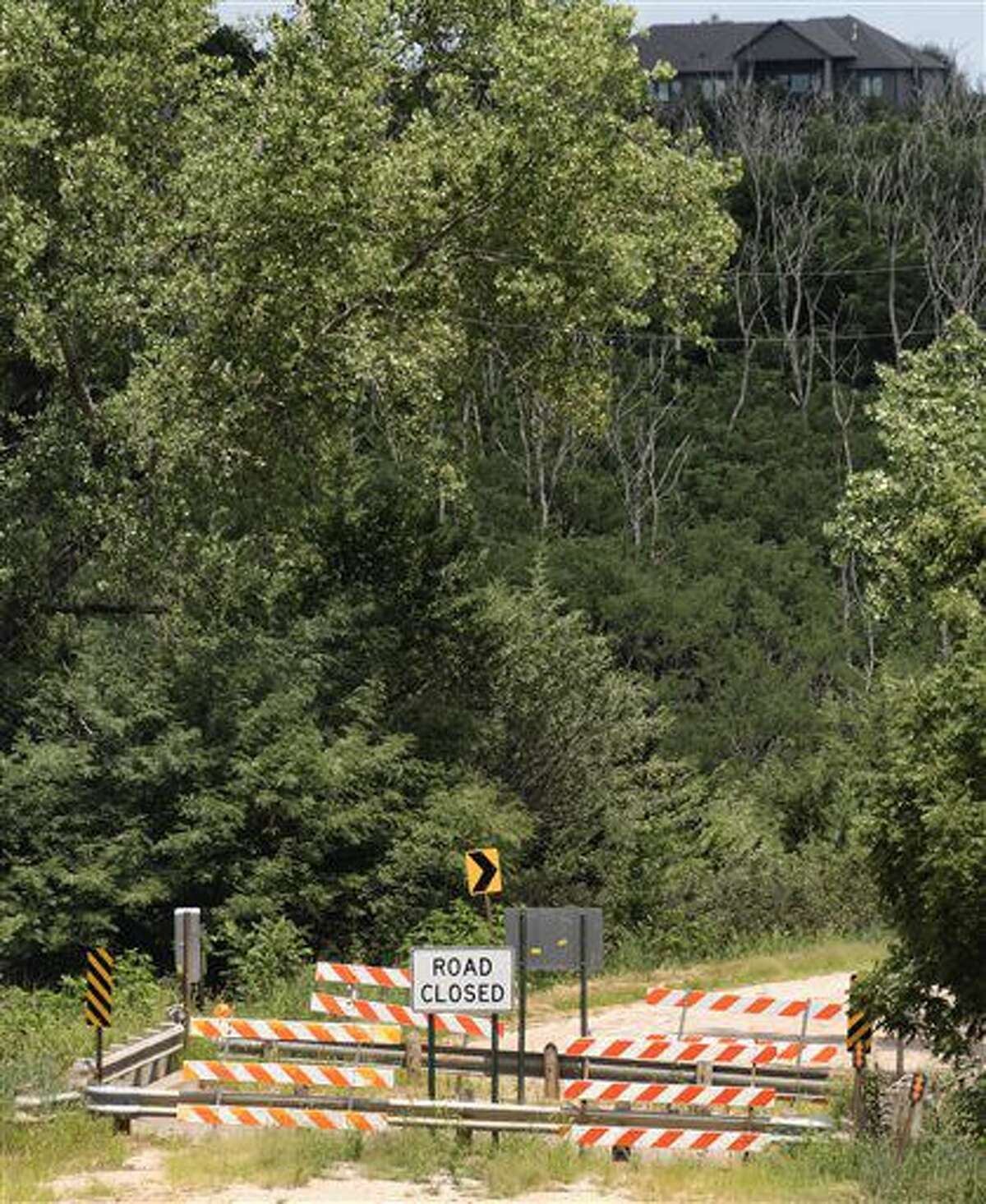 ADVANCE FOR USE SATURDAY, AUG. 6, 2016, AND THEREAFTER- In this July 29, 2016, photo, shows a bridge on the north side of Conestoga Lake has been closed by the Lancaster County engineering department in Denton, Neb. (Ted Kirk/The Journal-Star via AP)
