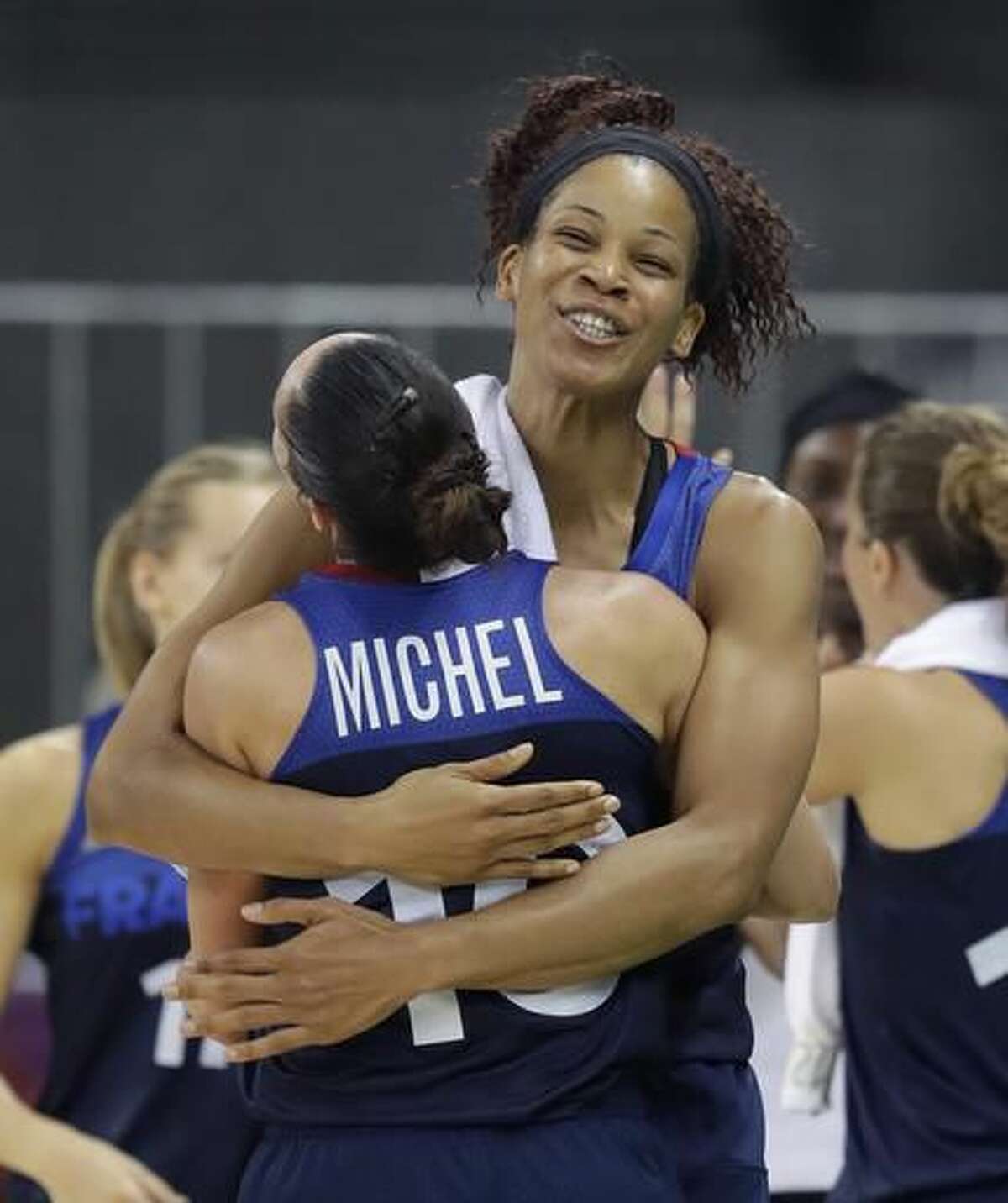 FranceFrance guard Sarah Michel (10) is hugged by teammate Marielle Amant after their women's basketball game against Turkey at the Youth Center at the 2016 Summer Olympics in Rio de Janeiro, Brazil, Saturday, Aug. 6, 2016. France defeated Turkey 55-39. (AP Photo/Carlos Osorio)