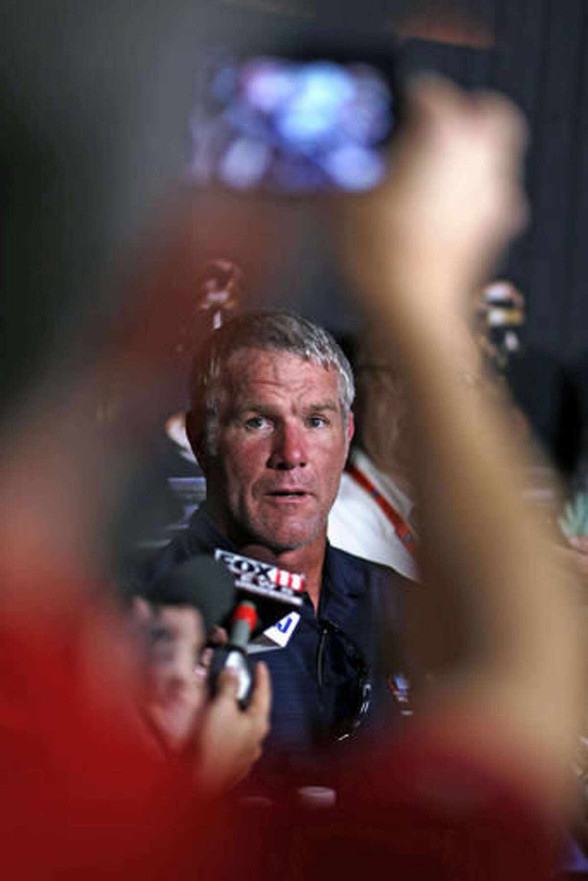 Pro Football Hall of Fame 2016 inductee Brett Favre talks to reporters Friday, Aug. 5, 2016, in Canton, Ohio. (AP Photo/Gene J. Puskar)