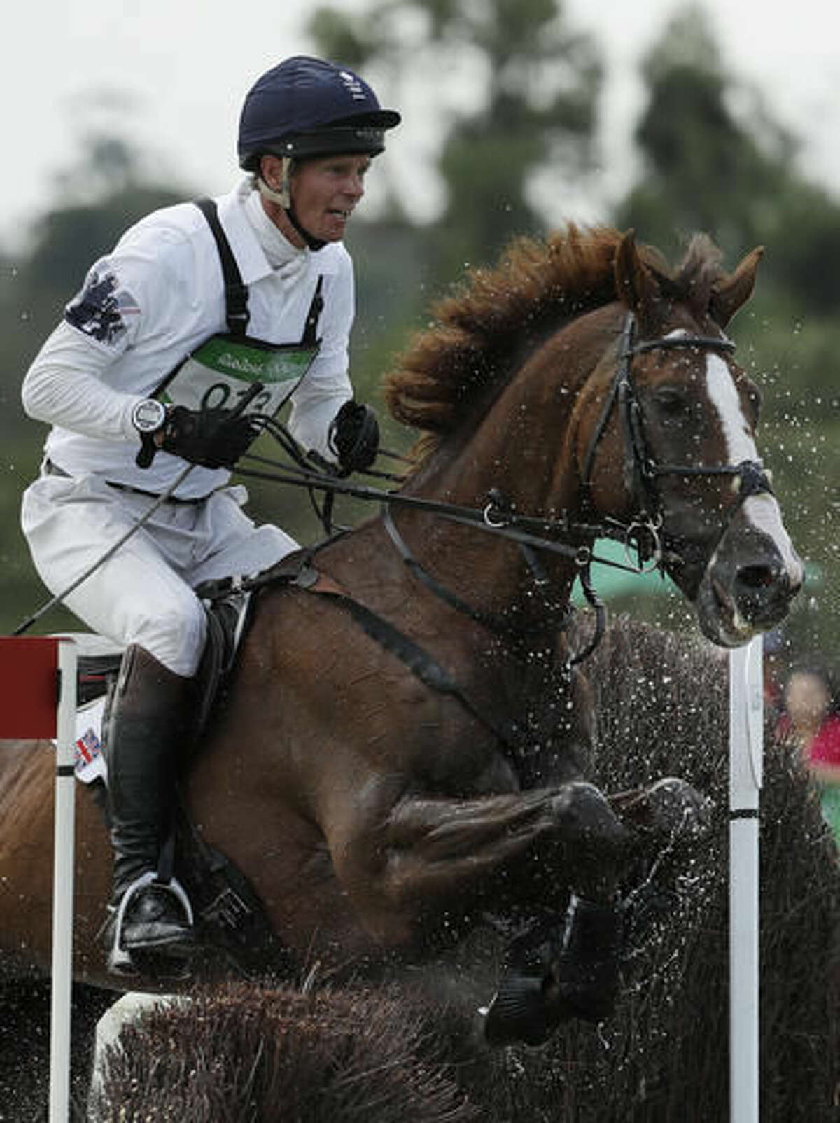 William Fox-Pitt, of Great Britain, competes on Chilli Morning in the equestrian eventing cross country phase at the 2016 Summer Olympics in Rio de Janeiro, Brazil, Monday, Aug. 8, 2016. (AP Photo/John Locher)